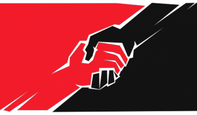 Image shows two hands across a red and black flag