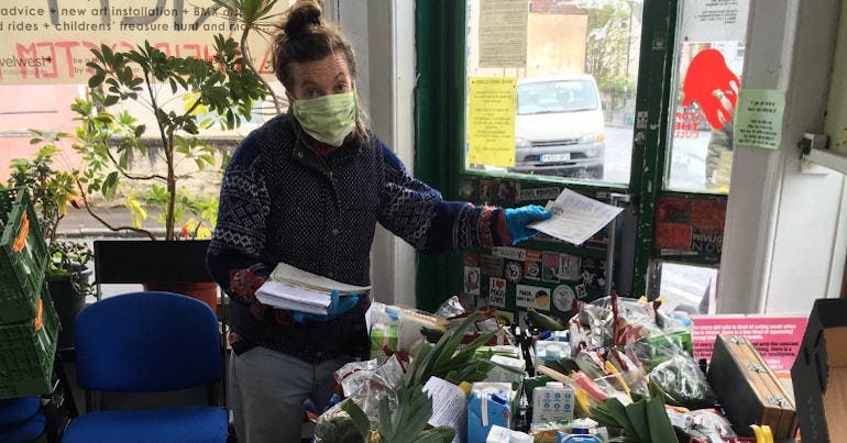 Base&Roses packs food boxes for the community in Bristol, and puts flyers in the boxes as a part of community organising