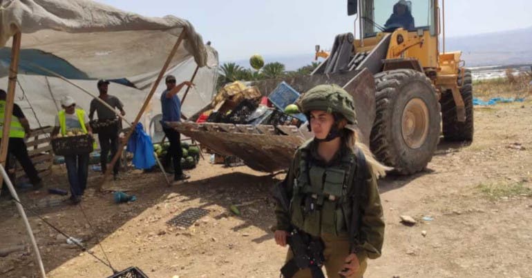 The Israeli military demolishes a fruit and vegetable stall in the Jordan Valley