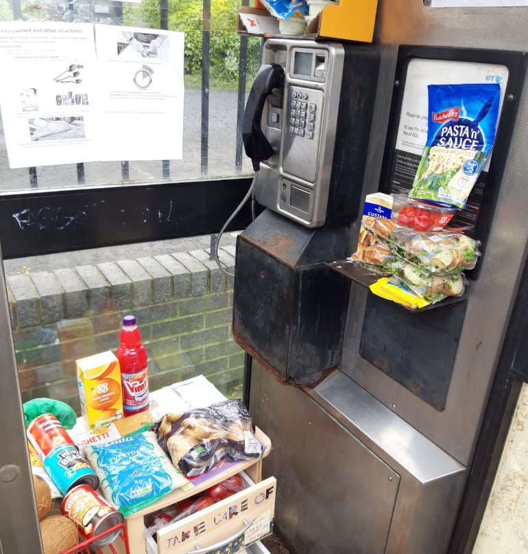 Free food being given away in a phone box