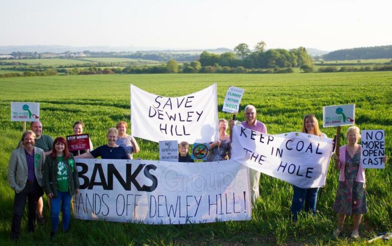 Image shows a group protest against Banks Group